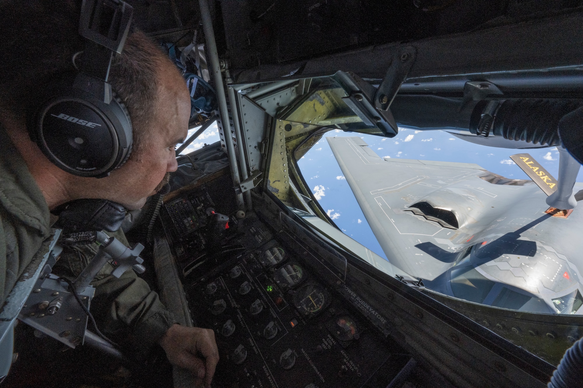 U.S. Air Force Senior Master Sgt. Wes Hudnall, Alaska Air National Guard KC-135 Stratotanker boom operator conducts aerial refueling operations for a B-2 Spirit during a training mission in the Indo-Pacific region, March 23, 2022. During the more than 50-hour round-trip trek to Australia and back, the B-2 received aerial refueling from numerous tanker aircraft—ensuring the mission was successful and further demonstrating the U.S. Air Forces’ global strike capabilities. (U.S. Air Force photo by Tech. Sgt. Hailey Haux)