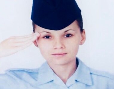 Senior Airman Hicks saluting