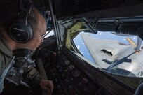 U.S. Air Force Senior Master Sgt. Wes Hudnall, Alaska Air National Guard KC-135 Stratotanker boom operator conducts aerial refueling operations for a B-2 Spirit during a training mission in the Indo-Pacific region, March 23, 2022. During the more than 50-hour round-trip trek to Australia and back, the B-2 received aerial refueling from numerous tanker aircraft—ensuring the mission was successful and further demonstrating the U.S. Air Forces’ global strike capabilities. (U.S. Air Force photo by Tech. Sgt. Hailey Haux)