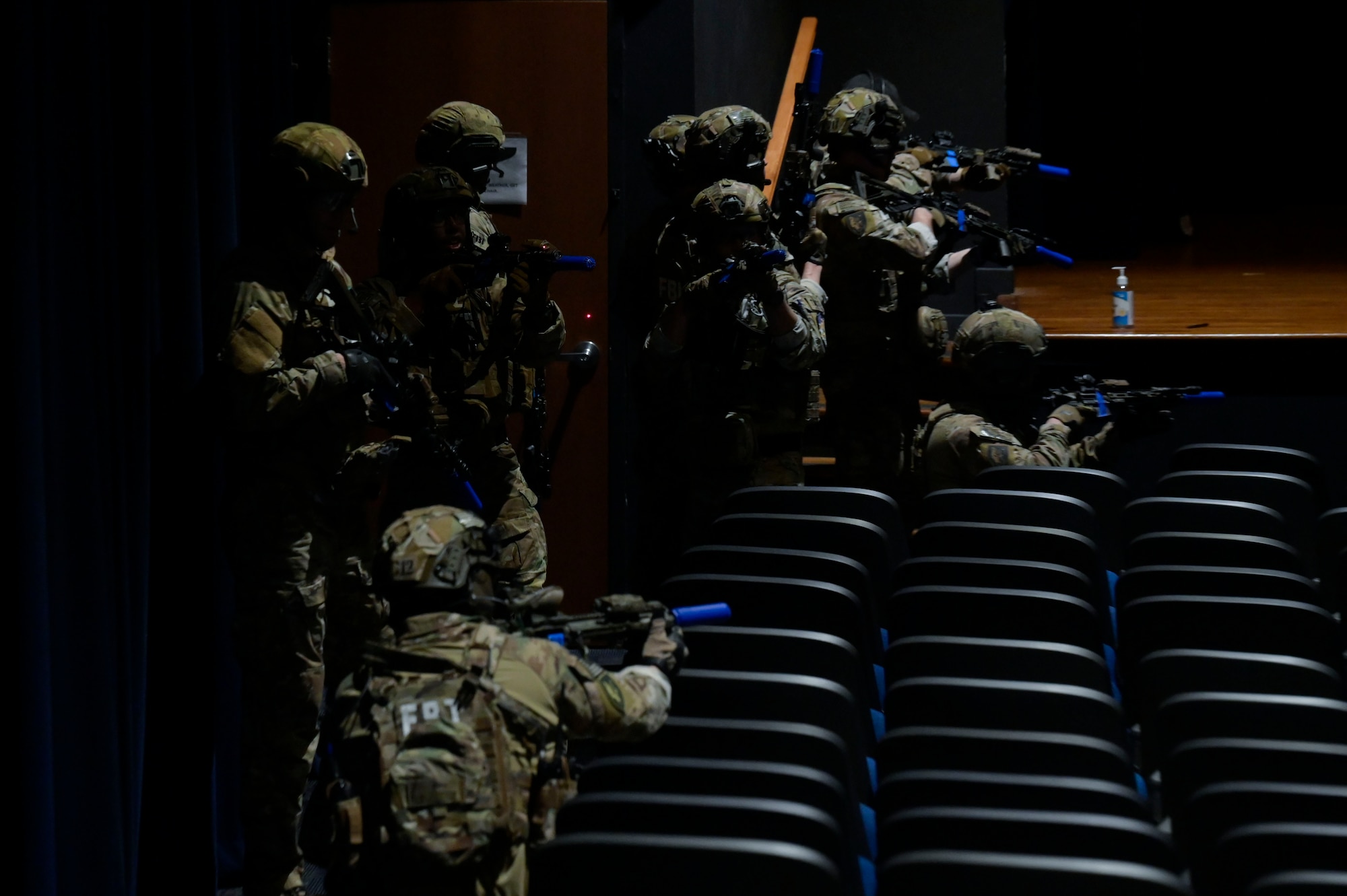 Members of the Federal Bureau of Investigation SWAT team clear a building