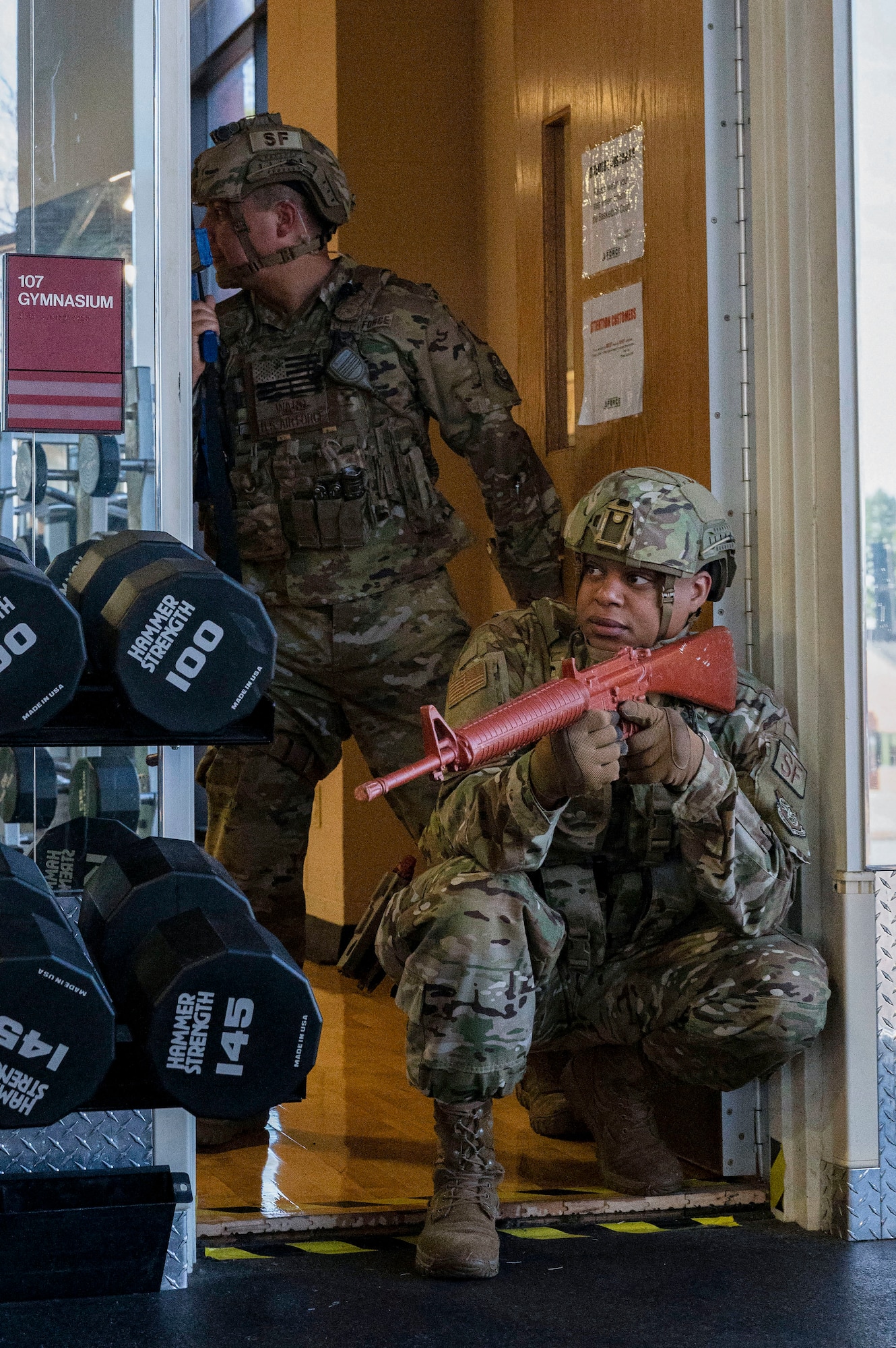 Airmen assigned to the 19th Security Forces Squadron secure a room during an emergency response