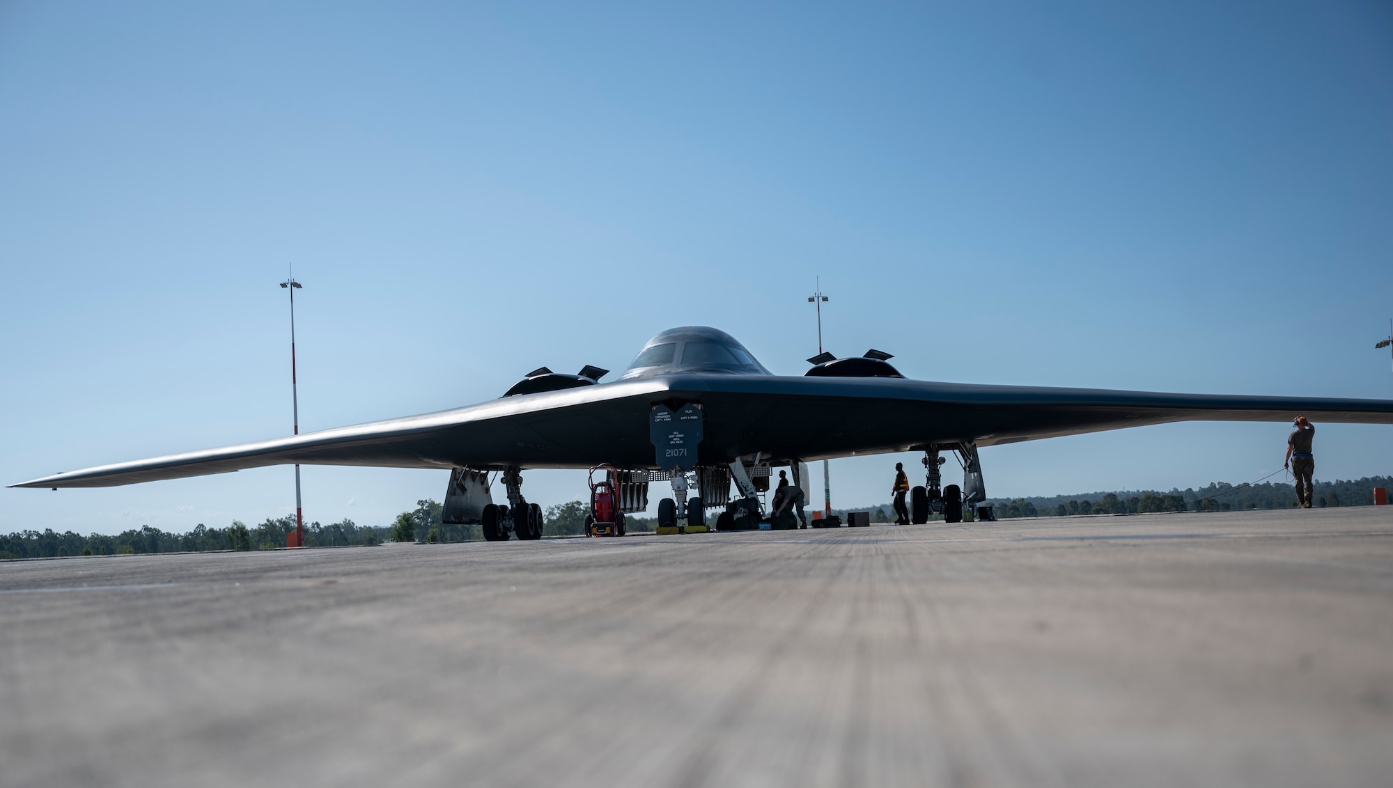 A B-2 Spirit sits at Royal Australian Air Force Base Amberley, Australia. After conducting integration with RAAF and U.S. fighters during a training mission in the Indo-Pacific region, March 23, 2022. After integrating in Australian airspace with more than eight joint and combined aircraft, the B-2 pilots landed at Amberley—for the first time—and conducted a crew swap on the ground before becoming airborne and integrating with F-22 Raptors from Joint Base Pearl Harbor-Hickam, Hawaii, and returning back to Whiteman. Exercising interoperability between the U.S. and Australia improves our great alliance and allows us to respond even faster, promoting security cooperation across the region. (U.S. Air Force photo by Tech. Sgt. Hailey Haux)