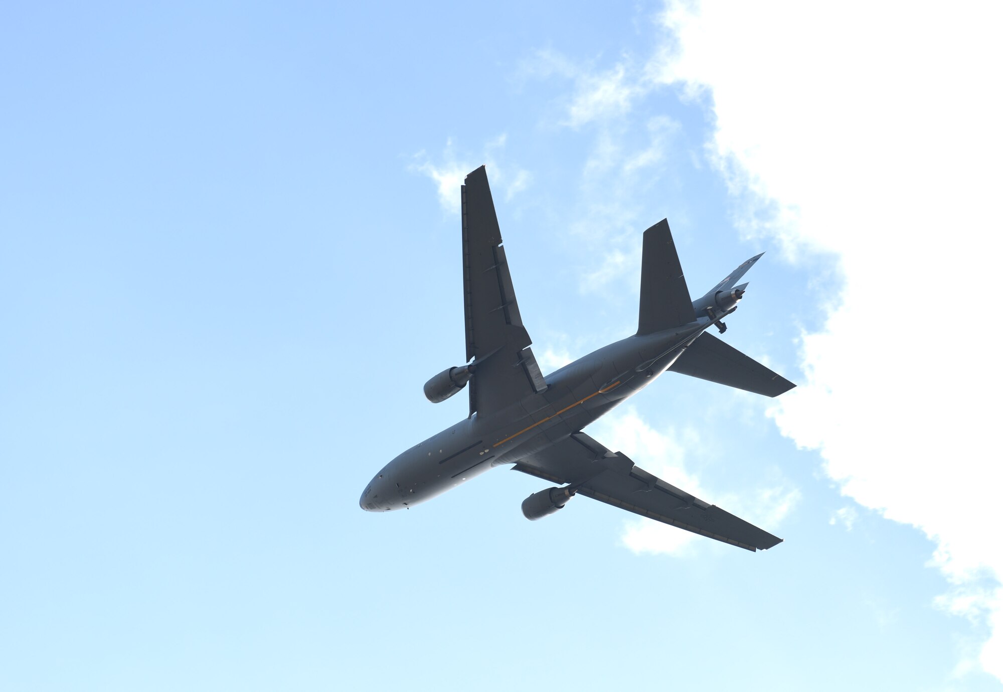 A U.S. Air Force KC-10 Extender aircraft assigned to the 305th Air Mobility Wing, Joint Base McGuire-Dix-Lakehurst, N.J., flies over Royal Air Force Mildenhall, England, March 9, 2022. The KC-10 is an Air Mobility Command advanced tanker and cargo aircraft designed to provide increased global mobility for U.S. Armed Forces. (U.S. Air Force photo by Karen Abeyasekere)