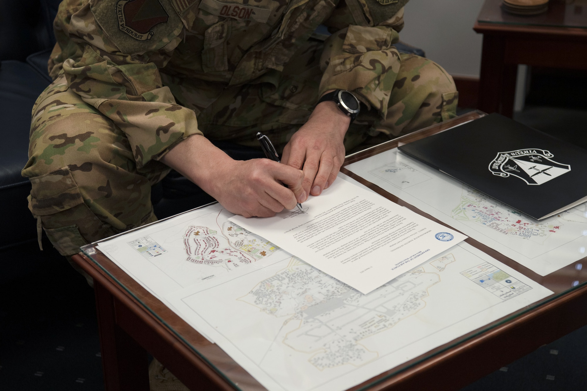 Man signs paper