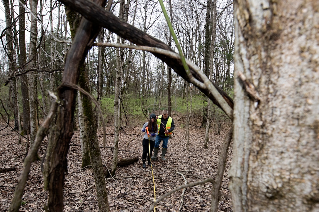 Mark G. McIntosh, project manager in the Regulatory Division Technical Services Branch, and Katie Alston, biologist in the same branch, create a perimeter for a vegetation plot March 18, 2022, while training near J. Percy Priest Lake in Nashville, Tennessee. They support regulatory permitting actions at the U.S. Army Corps of Engineers Nashville District Regulatory Division. (USACE Photo by Lee Roberts)