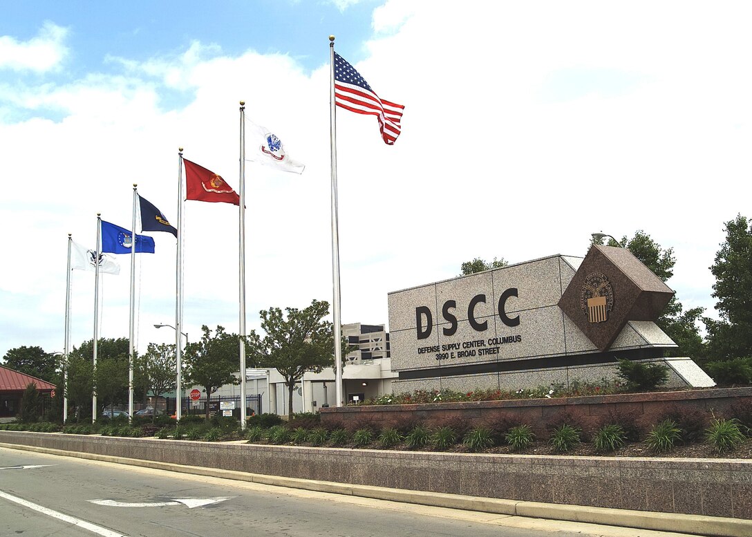DSCC main sign with flags.