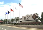 DSCC main sign with flags.
