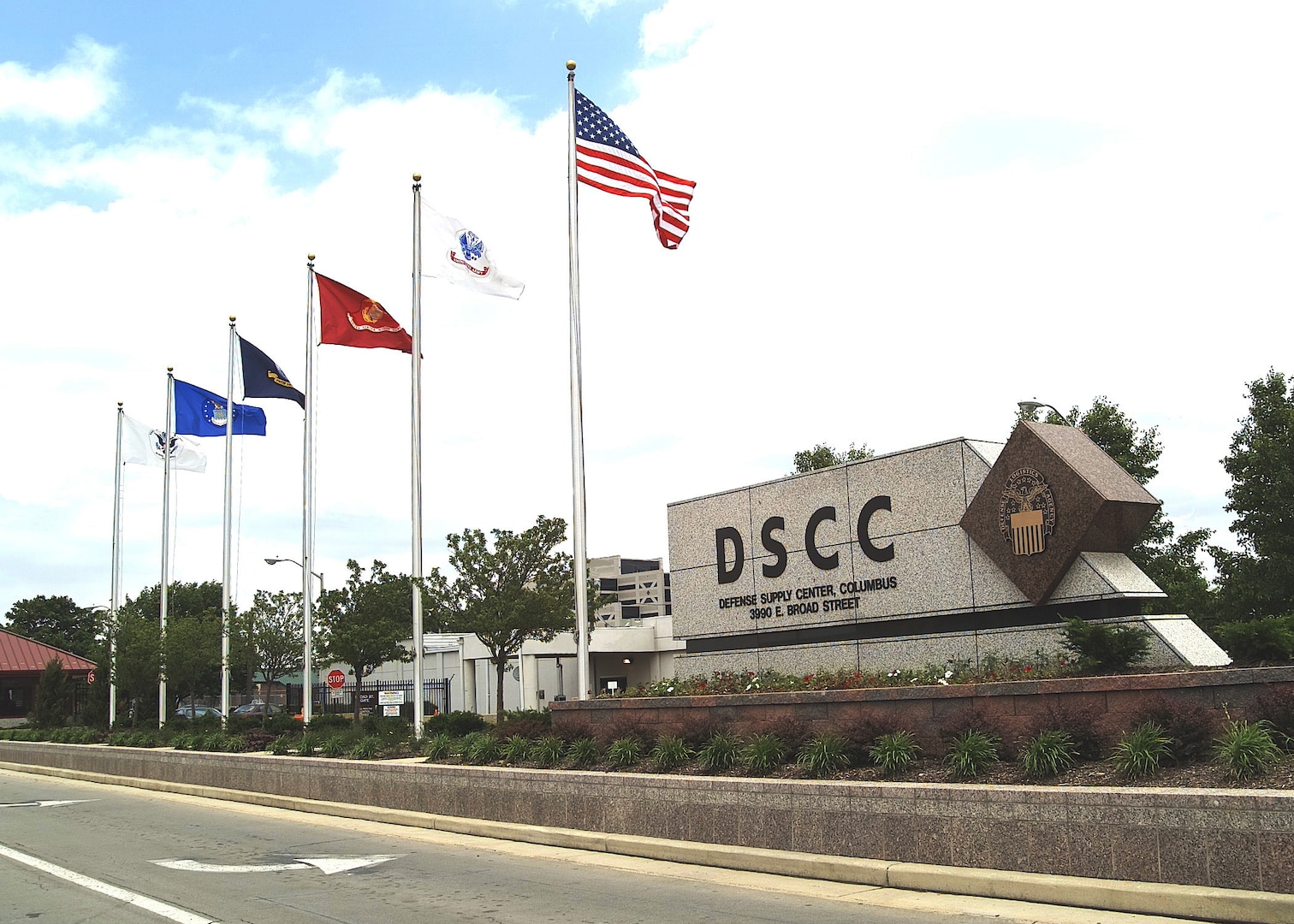 DSCC main sign with flags.