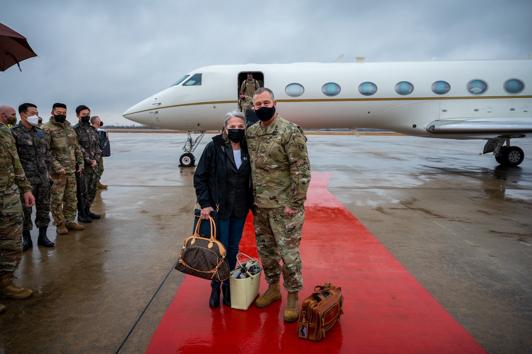 U.S. Army Gen. James H. Dickinson, U.S. Space Command commander, poses for a photo with his wife after arriving at Osan Air Base, Republic of Korea, March 19, 2022.