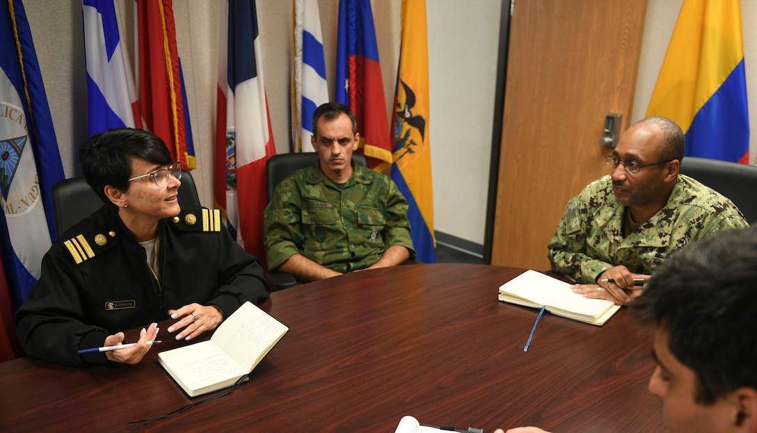 Peruvian navy Lt. Cmdr. Maria Belen Canales, Deputy Secretary of the Inter-American Naval Telecommunications Network (IANTN) Secretariat, left, briefs her department on current operations at U.S. Naval Forces Southern Command/U.S. 4th Fleet headquarters, March 17, 2022. Canales assumed the role of deputy secretary on Feb. 19, 2022. Established in 1962, IANTN’s mission is to maintain a permanent link among naval authorities of the Americas. U.S. Naval Forces Southern Command hosts the multi-national IANTN staff, which oversees IANTN detachments and operations centers in 18 partner nations in the Caribbean, Central and South America. USNAVSO/FOURTHFLT is the trusted maritime partner for Caribbean, Central and South America maritime forces leading to improved unity, security and stability.
