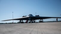 A B-2 Spirit sits at Royal Australian Air Force Base Amberley, Australia. After conducting integration with RAAF and U.S. fighters during a training mission in the Indo-Pacific region, March 23, 2022. After integrating in Australian airspace with more than eight joint and combined aircraft, the B-2 pilots landed at Amberley—for the first time—and conducted a crew swap on the ground before becoming airborne and integrating with F-22 Raptors from Joint Base Pearl Harbor-Hickam, Hawaii, and returning back to Whiteman. Exercising interoperability between the U.S. and Australia improves our great alliance and allows us to respond even faster, promoting security cooperation across the region. (U.S. Air Force photo by Tech. Sgt. Hailey Haux)