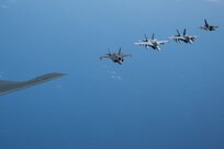 A U.S. Air force B-2 Spirit from Whiteman Air Force Base, Missouri, flies in formation with a Royal Australian Air Force F-35A Lightning IIs, two EA-18 Growlers, two RAAF F/A-18F Super Hornets and two U.S. Air Force F-16C Aggressors from Eielson Air Force Base, Alaska during a CONUS-to-CONUS training mission in the Indo-Pacific region, March 23, 2022. After integrating in Australian airspace, the B-2 pilots landed at Amberley—for the first time ever—and conducted a crew swap on the ground before becoming airborne and integrating with F-22 Raptors from Joint Base Pearl Harbor-Hickam, Hawaii, then returning back to Whiteman. (U.S. Air Force photo by Tech. Sgt. Hailey Haux)