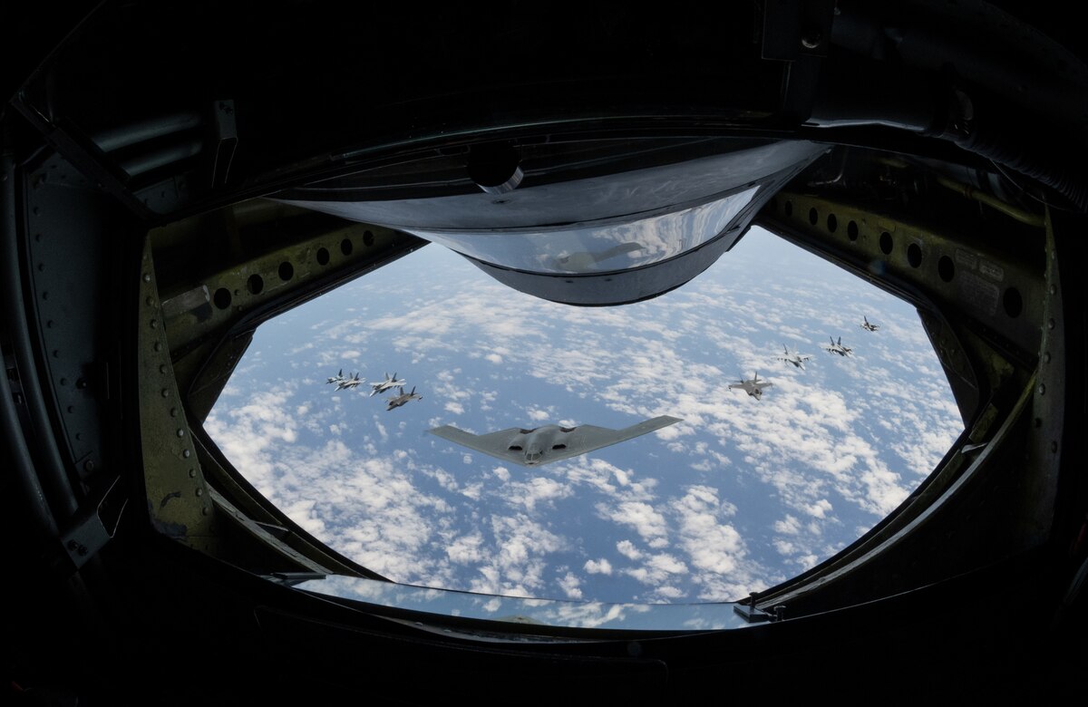 A U.S. Air Force B-2 Spirit from Whiteman Air Force Base, Mo., flies in formation with two Royal Australian Air Force F-35A Lightning IIs, two RAAF F/A-18F Super Hornets, two RAAF EA-18 Growlers, and two U.S. Air Force F-16C Aggressors from Eielson AFB, Alaska, during a training mission in the Indo-Pacific region, March 23, 2022. This mission was conducted to support Pacific Air Forces' training efforts with allies and partners in support of a free and open Indo-Pacific. (U.S. Air Force photo by Tech. Sgt. Hailey Haux)