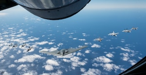 A U.S. Air Force B-2 Spirit from Whiteman Air Force Base, Mo., flies in formation with two Royal Australian Air Force F-35A Lightning IIs, two RAAF F/A-18F Super Hornets, two RAAF EA-18 Growlers, and two U.S. Air Force F-16C Aggressors from Eielson Air Force Base, Alaska during a training mission in the Indo-Pacific region, March 23, 2022. Once in Australian airspace, the B-2 crews from the 509th Bomb Wing teamed up with a KC-135 Stratotanker from the Alaska Air National Guard to complete aerial refueling before integrating with the eight fighter aircraft. (U.S. Air Force photo by Tech. Sgt. Hailey Haux)