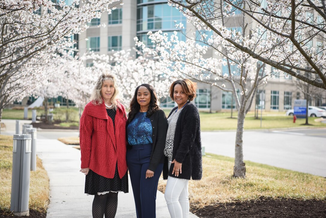 From left, Karen McMullen and Denise Hurt, security specialists, and Racquel Cook, program support assistant, pose for a photo outside of the U.S. Army Corps of Engineers, Baltimore District, Real Property Services Field Office (RSFO) in Annapolis Junction, Maryland, March 24, 2022. McMullen, Hurt and Cook make up an all-women security team as part of RSFO. (U.S. Army photo by Thomas I. Deaton)