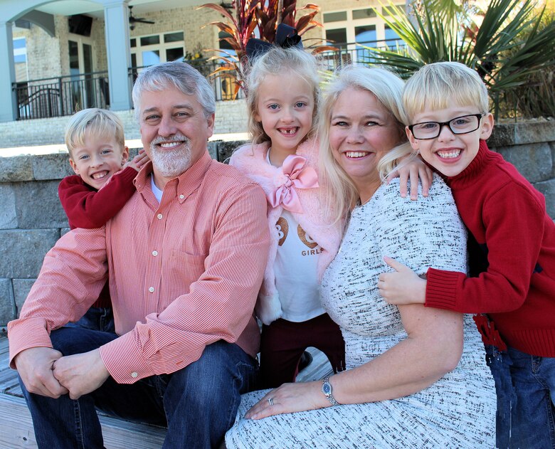 Family Photo: Kris Mullins poses with her husband John, and children Jackson, Seth and Alyssa, all age nine. Mullins is the first female Chief of Staff in the Mobile District, a position she has held since 2013. (Courtesy photo)