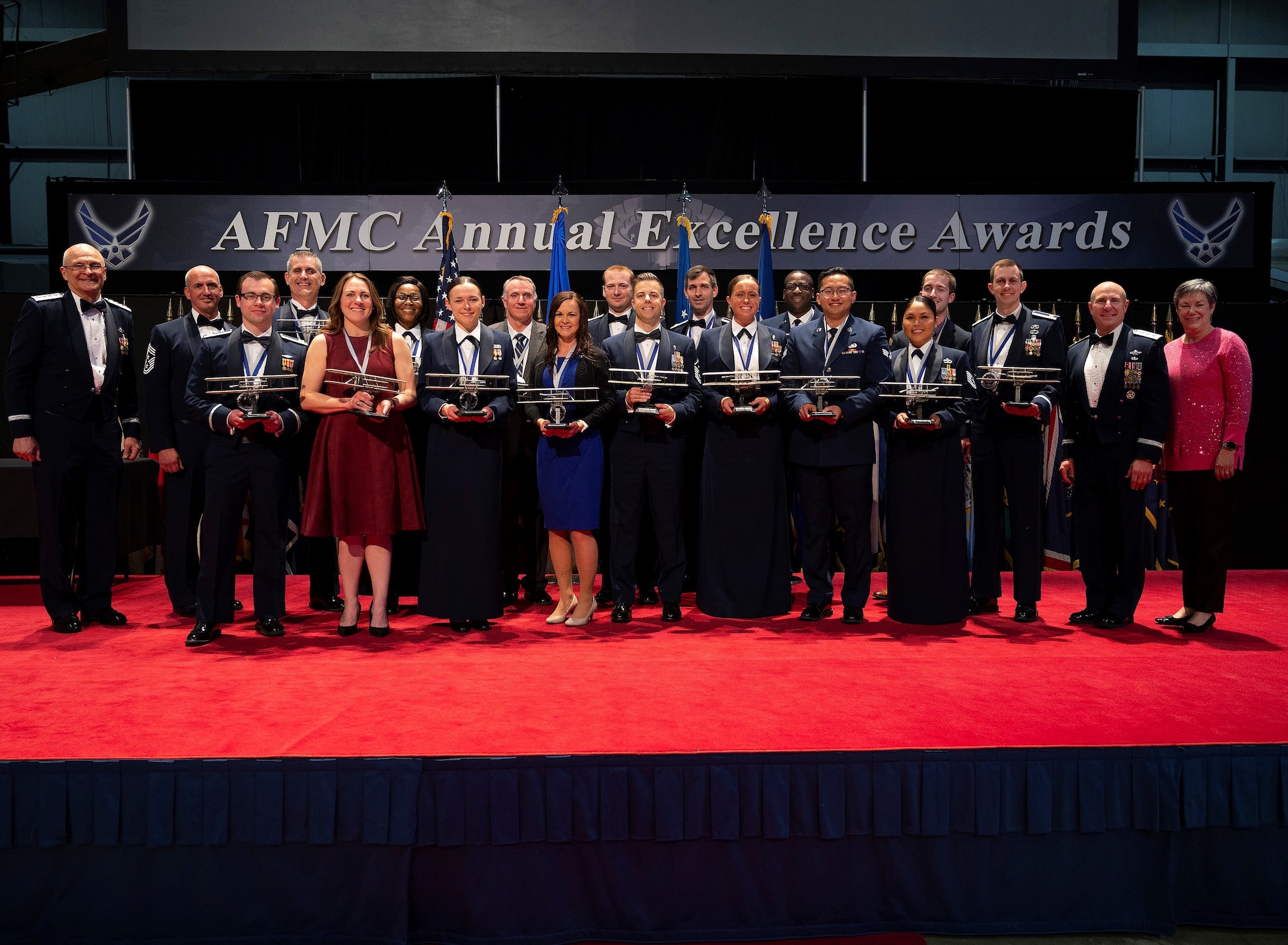 Winners of the Air Force Materiel Command Annual Excellence Awards pose with AFMC leadership at the end of the ceremony, March 23, 2022, at the Nation Museum of the U.S. Air Force at Wright-Patterson Air Force Base, Ohio. Airmen, military and civilian, from AFMC centers around the Air Force competed in 17 categories to be named the top Airman and to go on to compete at the Air Force level.  (U.S. Air Force photo by R.J. Oriez)