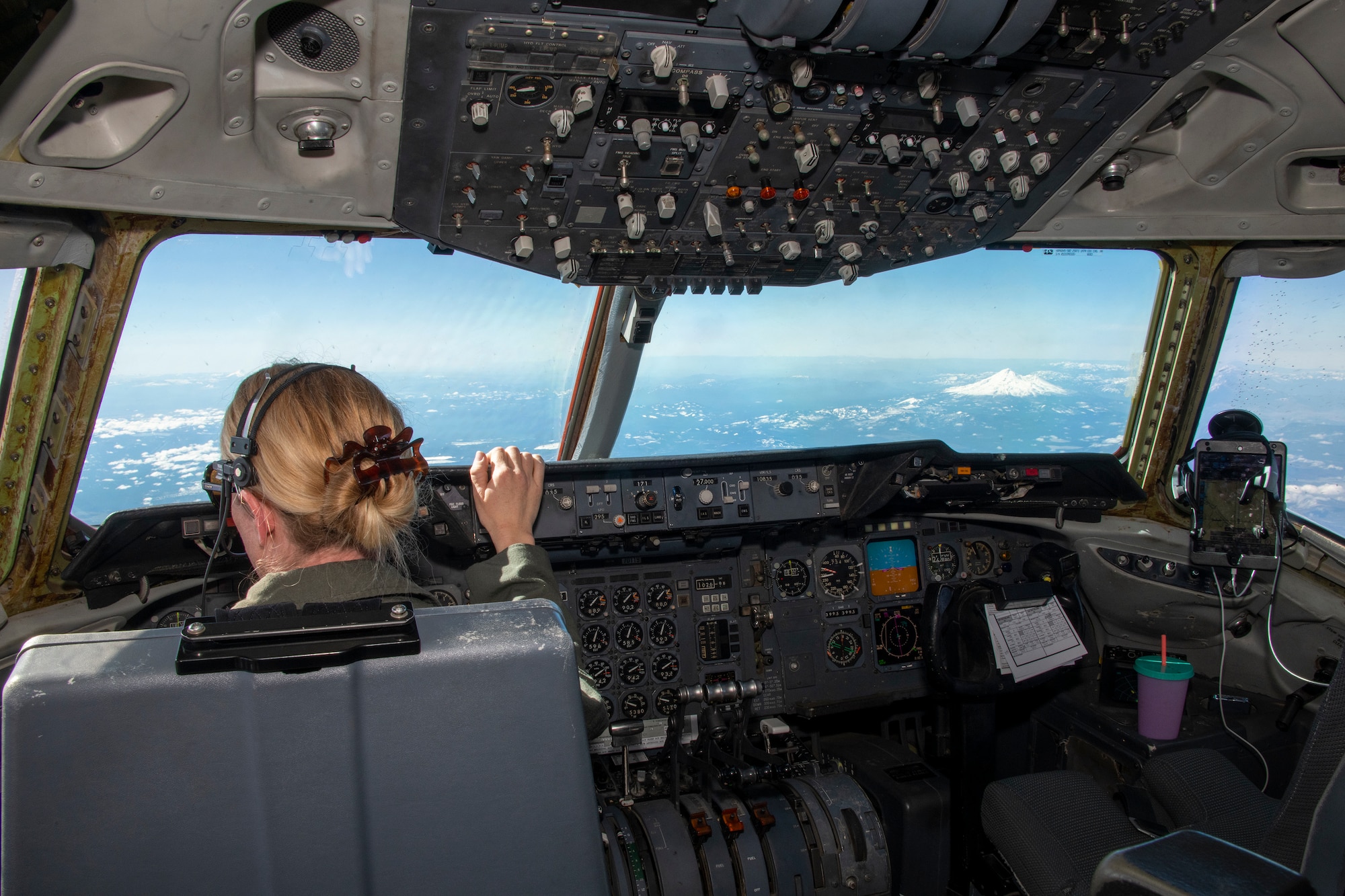 U.S. Air Force Maj. Jessie Olson, 79th Air Refueling Squadron KC-10 Extender instructor pilot, flies a tanker over the Pacific Northwest, March 22, 2022. In honor of Women's History Month, an all-female KC-10 flight crew from the 60th and 349th Air Mobility Wings flew on an aerial refueling training mission over California and Oregon. (U.S. Air Force photo by Heide)