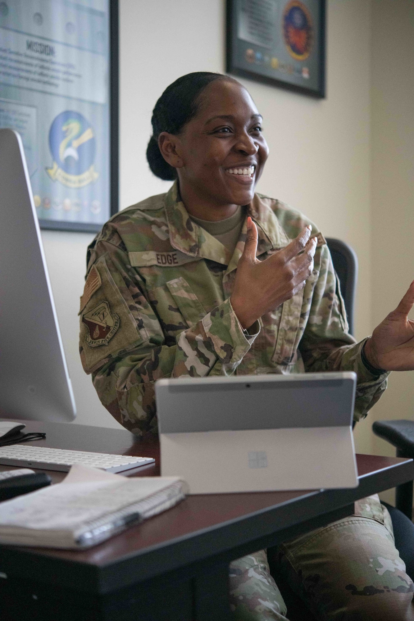 Airman listens to her students.