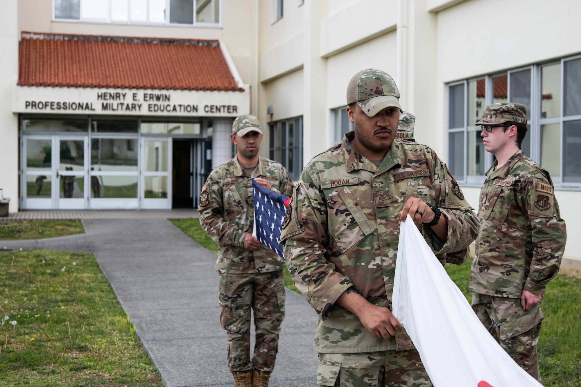 Airmen fold the U.S. and Japan flags.