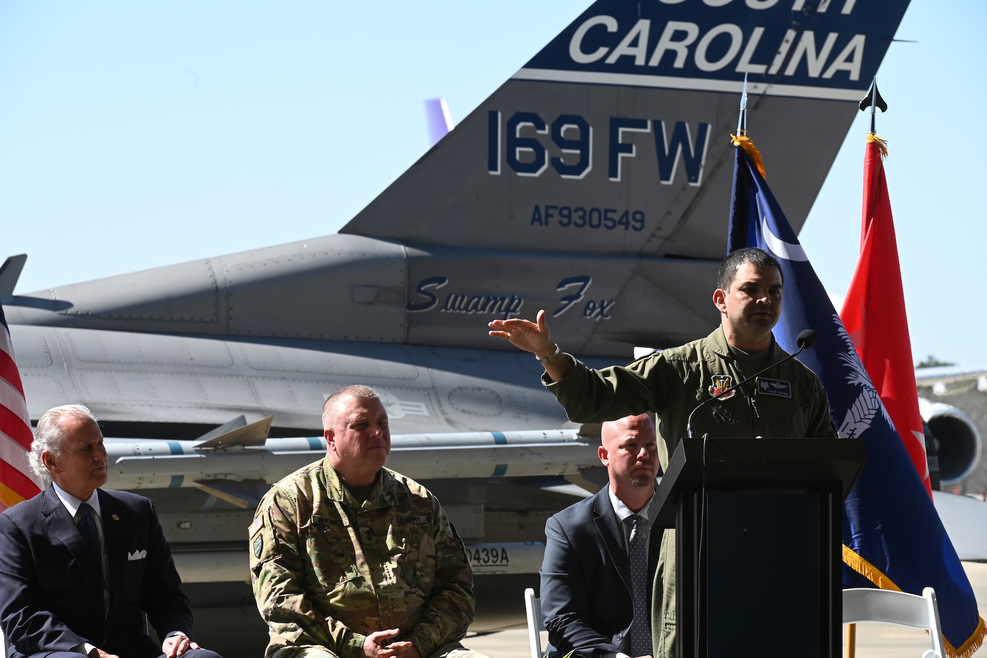 U.S. Air Force Col. Quaid Quadri, 169th Fighter Wing commander, speaks to local media and distinguished visitors at the Columbia Metropolitan Airport West Cargo Hangar, Columbia, South Carolina during a press conference, March 21, 2022. Columbia Metropolitan Airport hosts a press conference to announce a six-month temporary move of F-16 fighter jet flying operations from the the South Carolina Air National Guard's 169th Fighter Wing at nearby McEntire Joint National Guard Base to their airport. This joint partnership, regarding the temporary relocation of F-16 aircraft, will begin in April 2022. Speaking during the press conference are South Carolina Governor Henry McMaster; U.S. Army Maj. Gen. Van McCarty, The Adjutant General of South Carolina; U.S. Air Force Col. Quaid Quadri, 169th Fighter Wing Commander; and Mike Gula Executive Director at Columbia Metropolitan Airport.  (U.S. Air National Guard photo by Senior Master Sgt. Edward Snyder, 169th Fighter Wing)