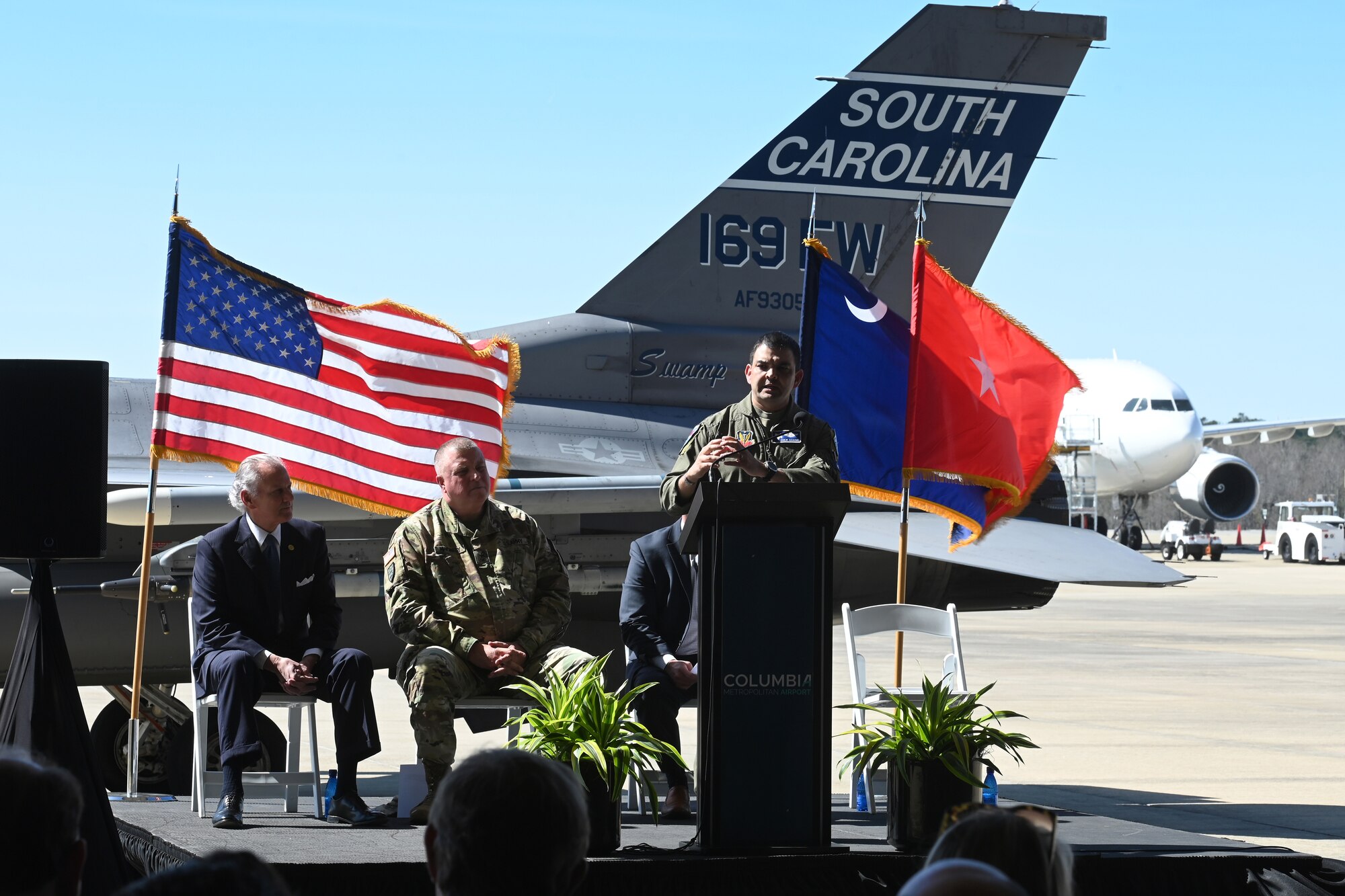 U.S. Air Force Col. Quaid Quadri, 169th Fighter Wing commander, speaks to local media and distinguished visitors at the Columbia Metropolitan Airport West Cargo Hangar, Columbia, South Carolina during a press conference, March 21, 2022. Columbia Metropolitan Airport hosts a press conference to announce a six-month temporary move of F-16 fighter jet flying operations from the the South Carolina Air National Guard's 169th Fighter Wing at nearby McEntire Joint National Guard Base to their airport. This joint partnership, regarding the temporary relocation of F-16 aircraft, will begin in April 2022. Speaking during the press conference are South Carolina Governor Henry McMaster; U.S. Army Maj. Gen. Van McCarty, The Adjutant General of South Carolina; U.S. Air Force Col. Quaid Quadri, 169th Fighter Wing Commander; and Mike Gula Executive Director at Columbia Metropolitan Airport.  (U.S. Air National Guard photo by Senior Master Sgt. Edward Snyder, 169th Fighter Wing)