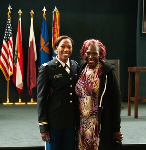 2nd Lt. Gabrielle Cole is congratulated by her mother after completing U.S. Army Flight School at Fort Rucker, Al, March 24, 2022.