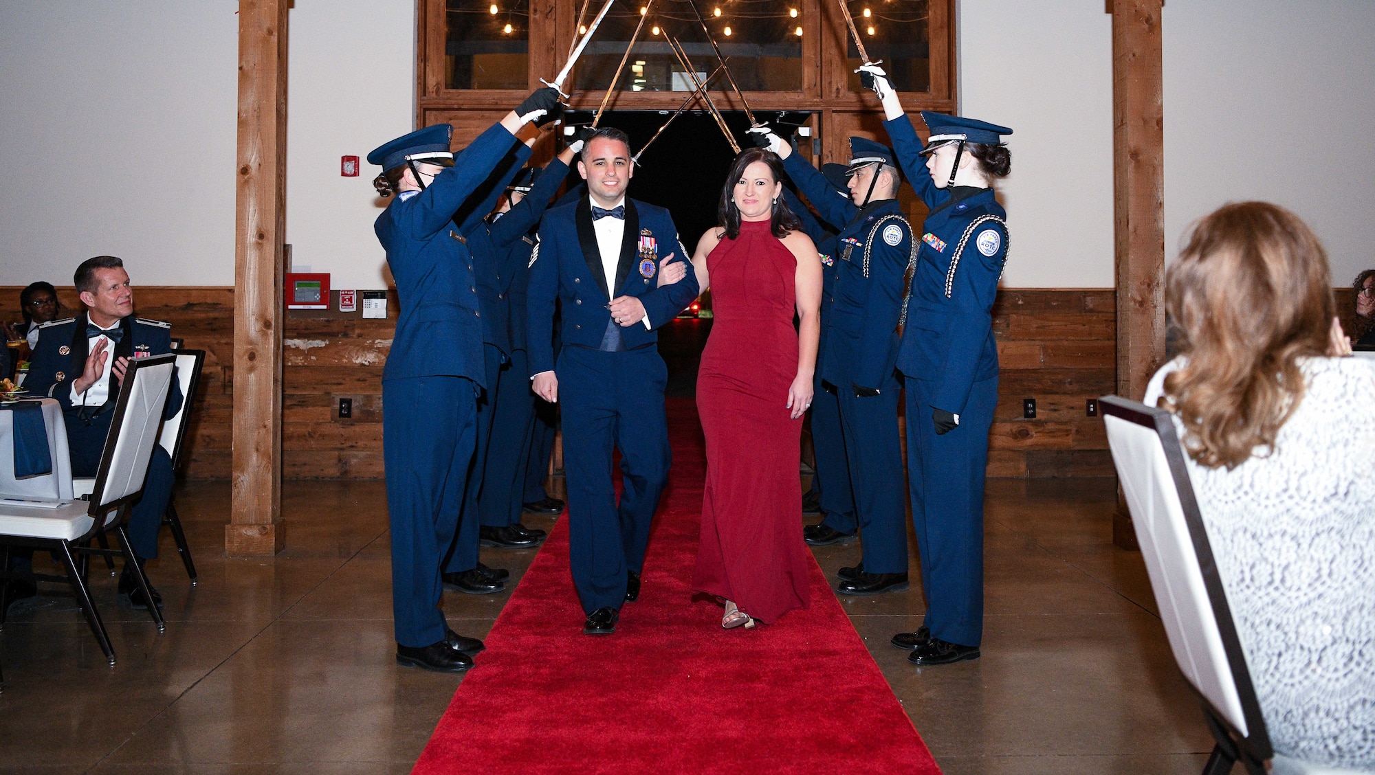 Master Sgt. Alexander James, a recruiter with the 350th Recruiting Squadron and his wife Amanda James pose for a photo inside the Gruene Events Center at New Braunfels, Texas, March 10, 2022, during the 43rd annual Operation Blue Suit award banquet.