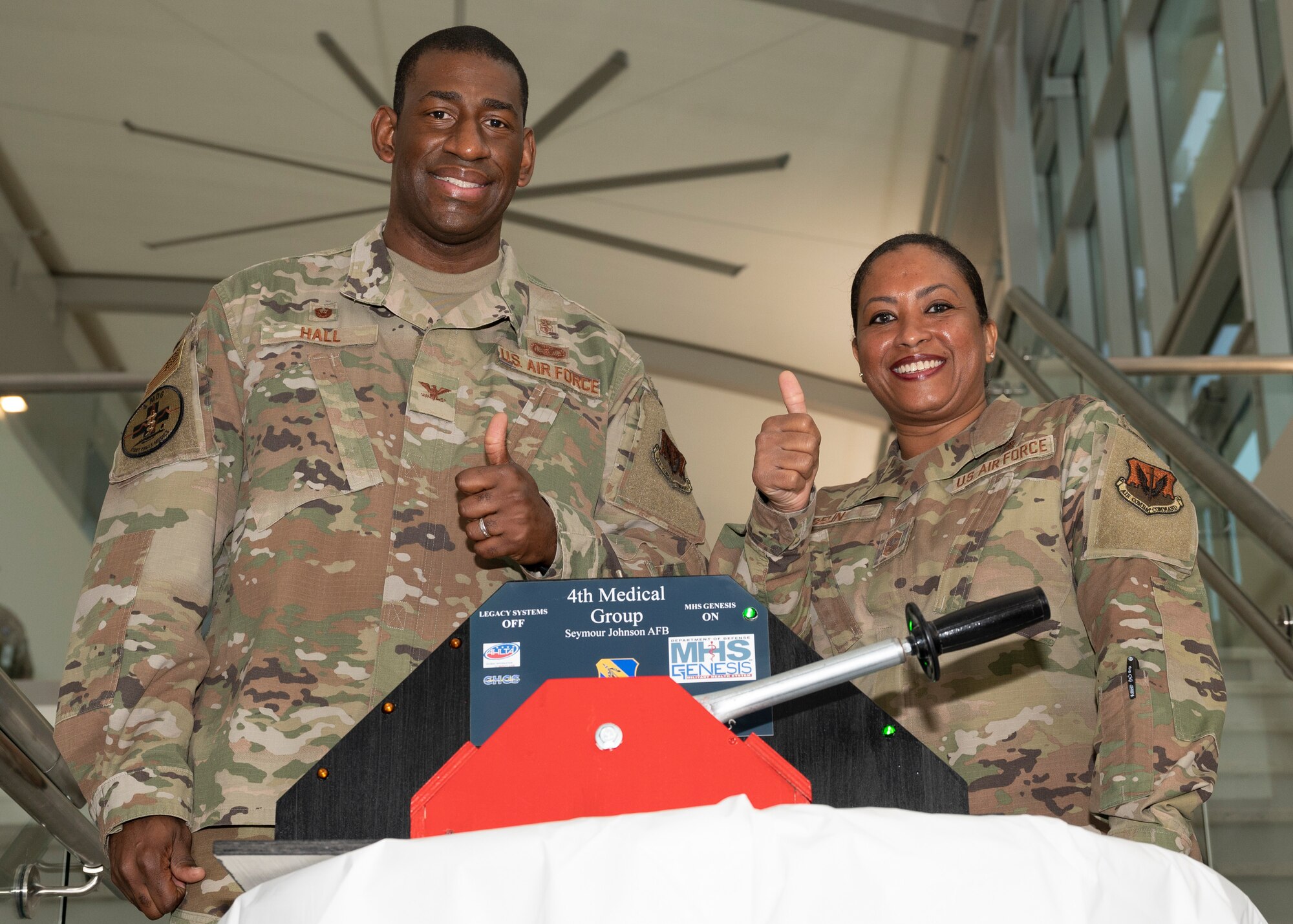Col. Dolphis Hall, 4th Medical Group commander, left, and Chief Master Sgt. Kaleah Belin, 4th MDG senior enlisted leader, pose for a photo at the Thomas Koritz Medical Clinic at Seymour Johnson Air Force Base, North Carolina, March 19, 2022.