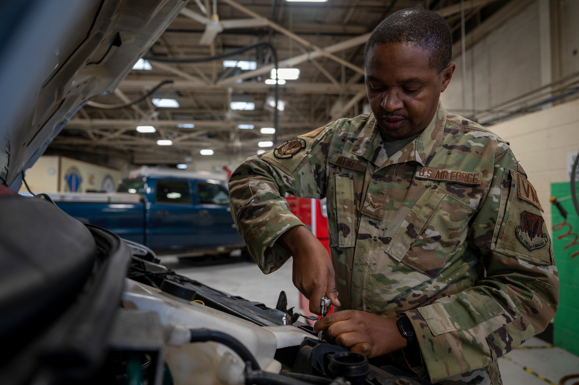 Airman 1st Class Bethwel Waitiki, 4th Logistics Readiness Squadron vehicle maintenance technician, works on a truck at Seymour Johnson Air Force Base, North Carolina, March 3, 2022.