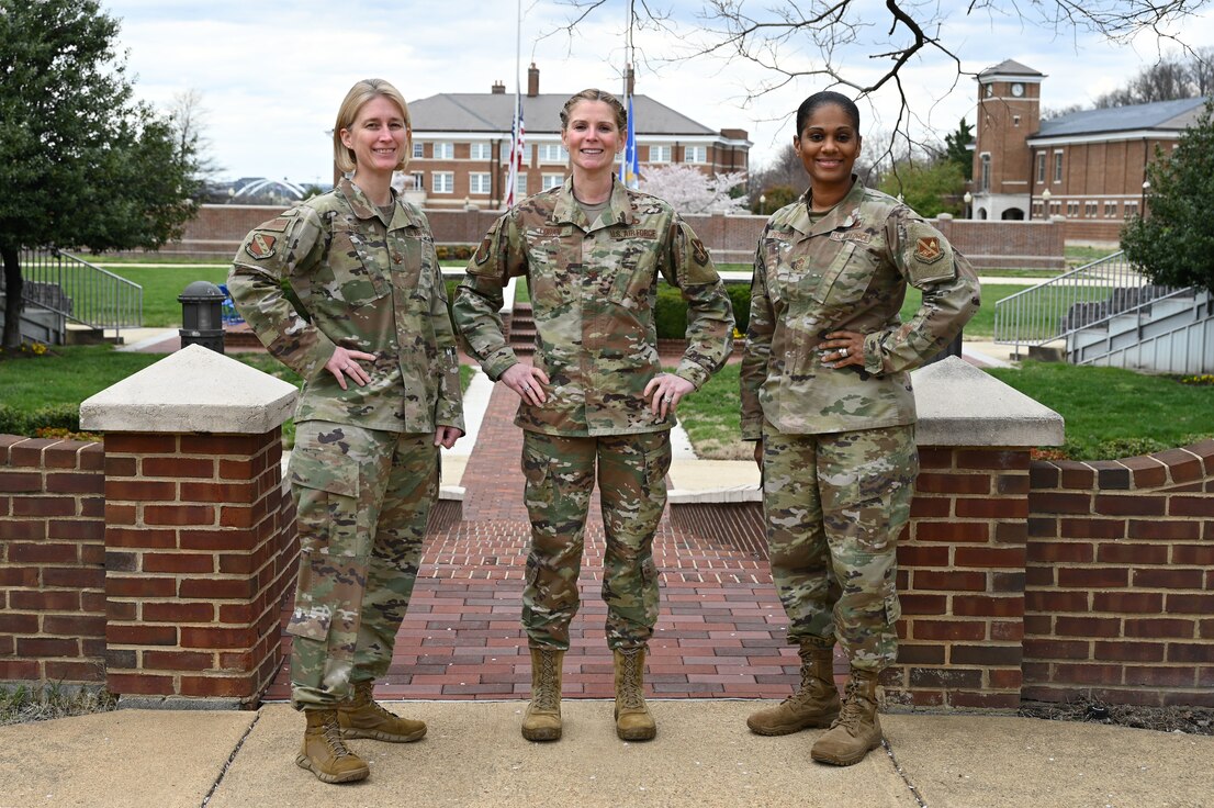 The Joint Base Anacostia-Bolling and 11th Wing all female command team, U.S. Air Force Col. Erica Rabe, vice commander; Col. Cat Logan, commander; and Command Chief Master Sgt. Christy Peterson pose for a photo on JBAB, Washington, D.C., March 25, 2022. The command team shared a message of diversity, equity, inclusion, motivation and hope for Women's History Month. (U.S. Air Force photo by Airman 1st Class Anna Smith)