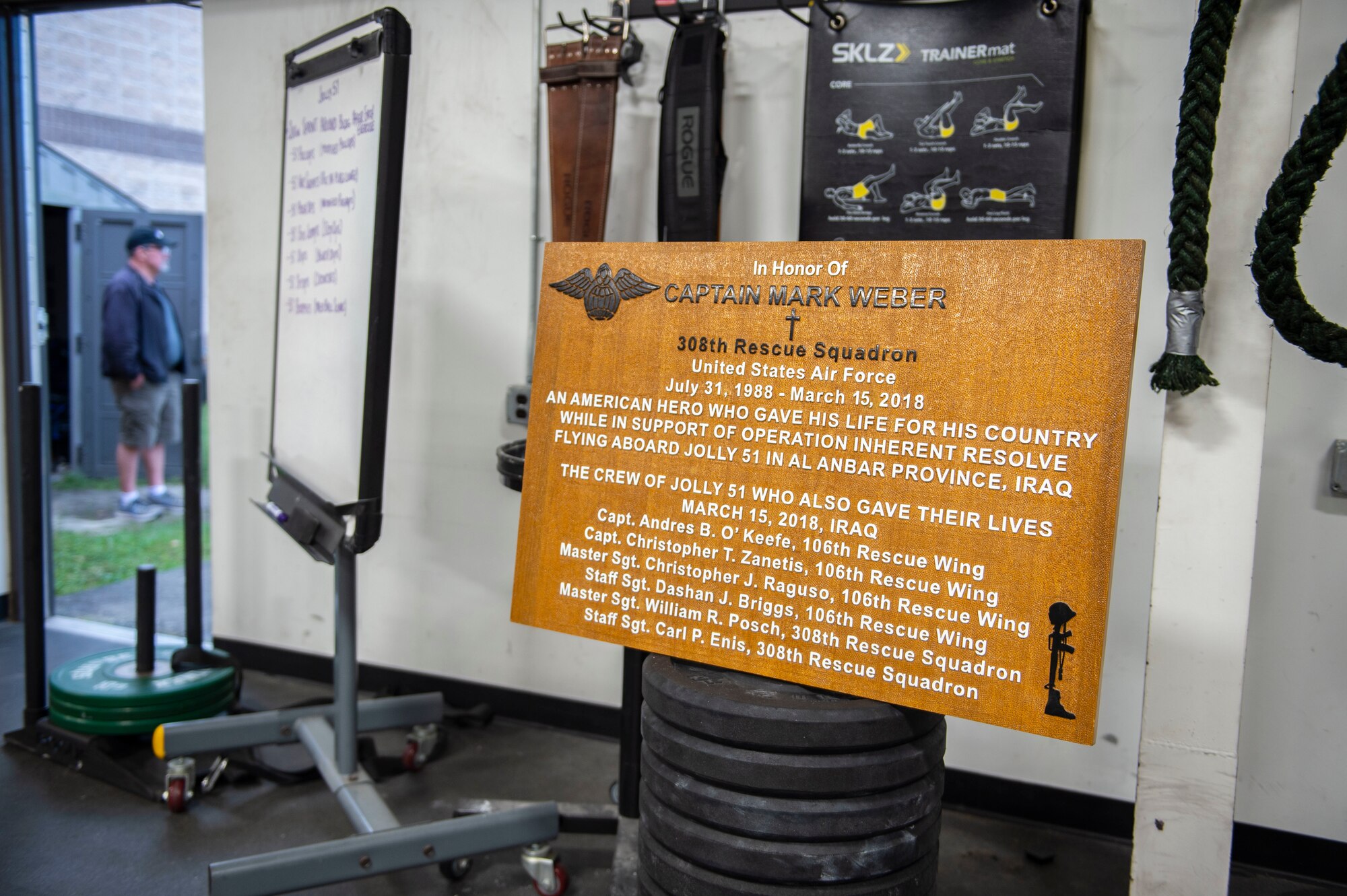 A photo of an orange plaque.