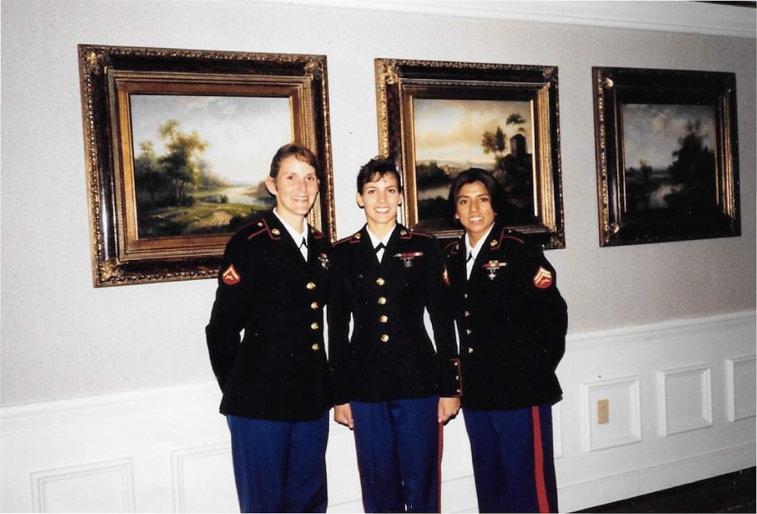 Christina Johnson (left), Marine Veteran and project manager for the National Museum of the Marine Corps, stands next to her fellow Marines during her graduation from the Marine Corps Embassy Security Guard School at Marine Corps Base Quantico, Va. Johnson joined the Marine Corps in 1993 as military police and later on decided to join the MCESG program.