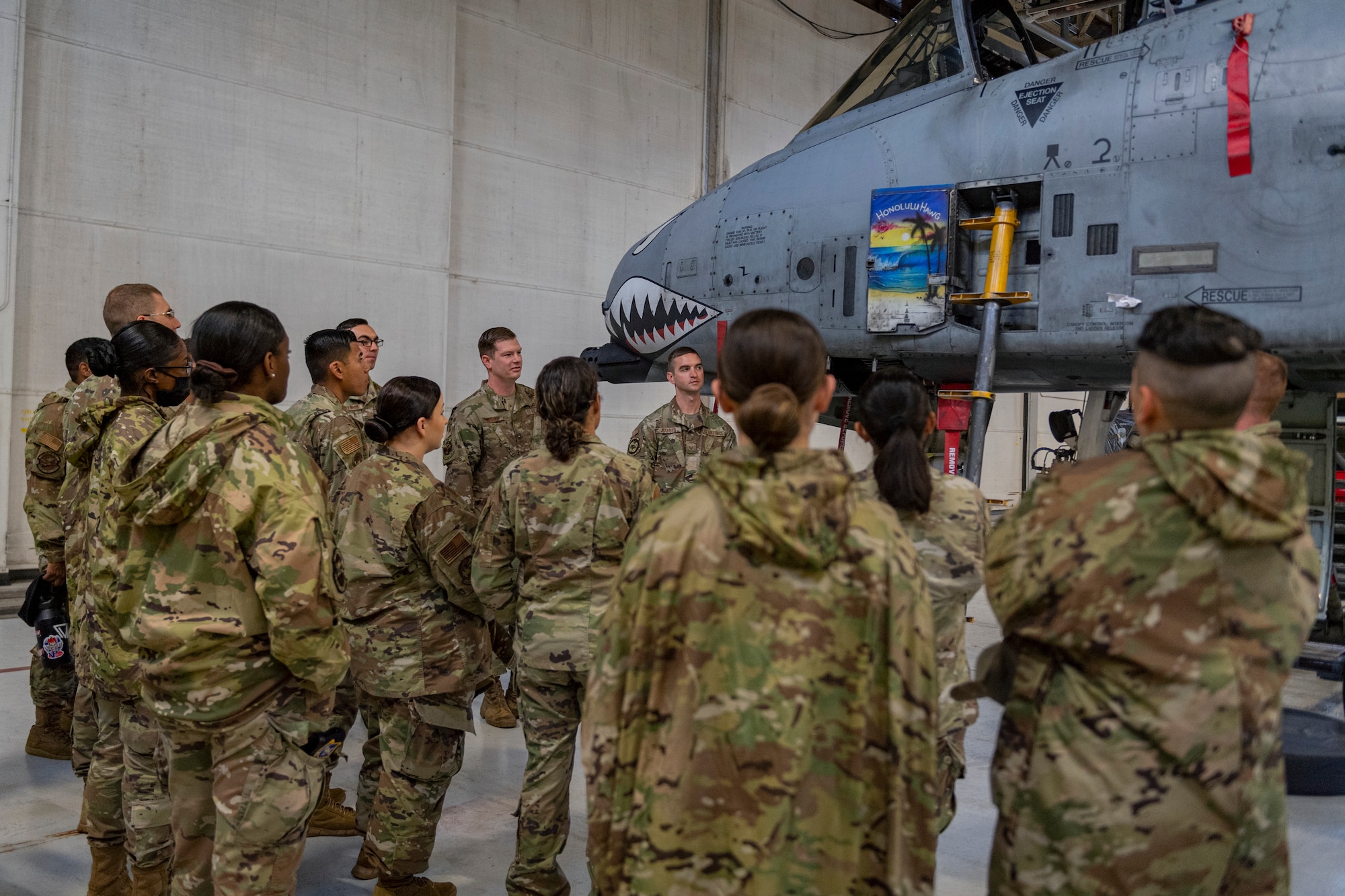 Photo of Airmen observing an A-10C Thunderbolt II