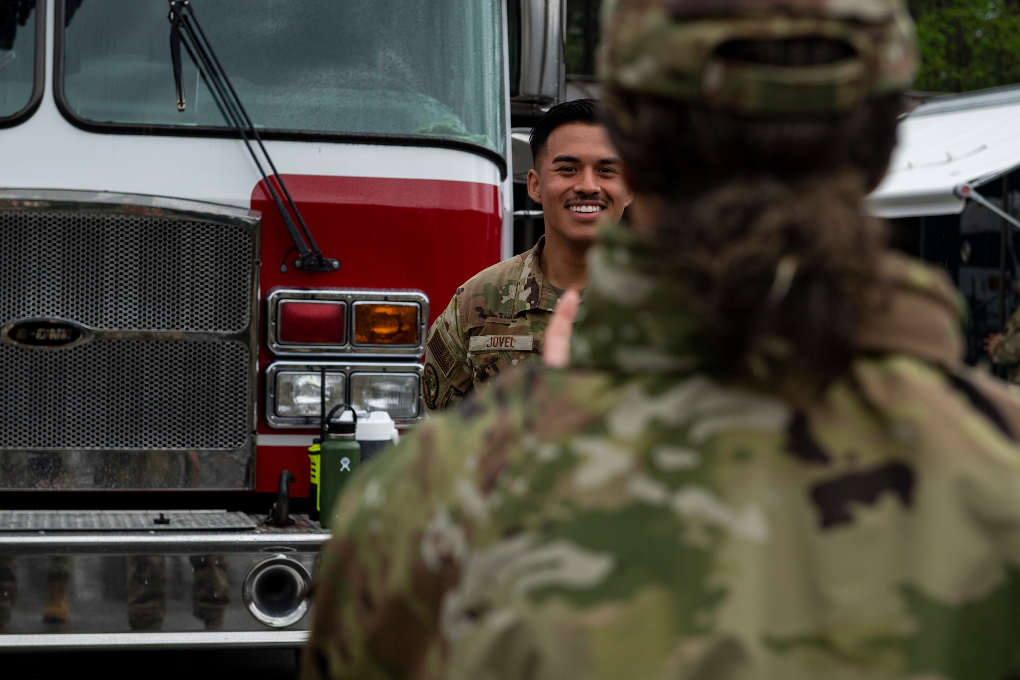 Photo of an Airman laughing during a tour