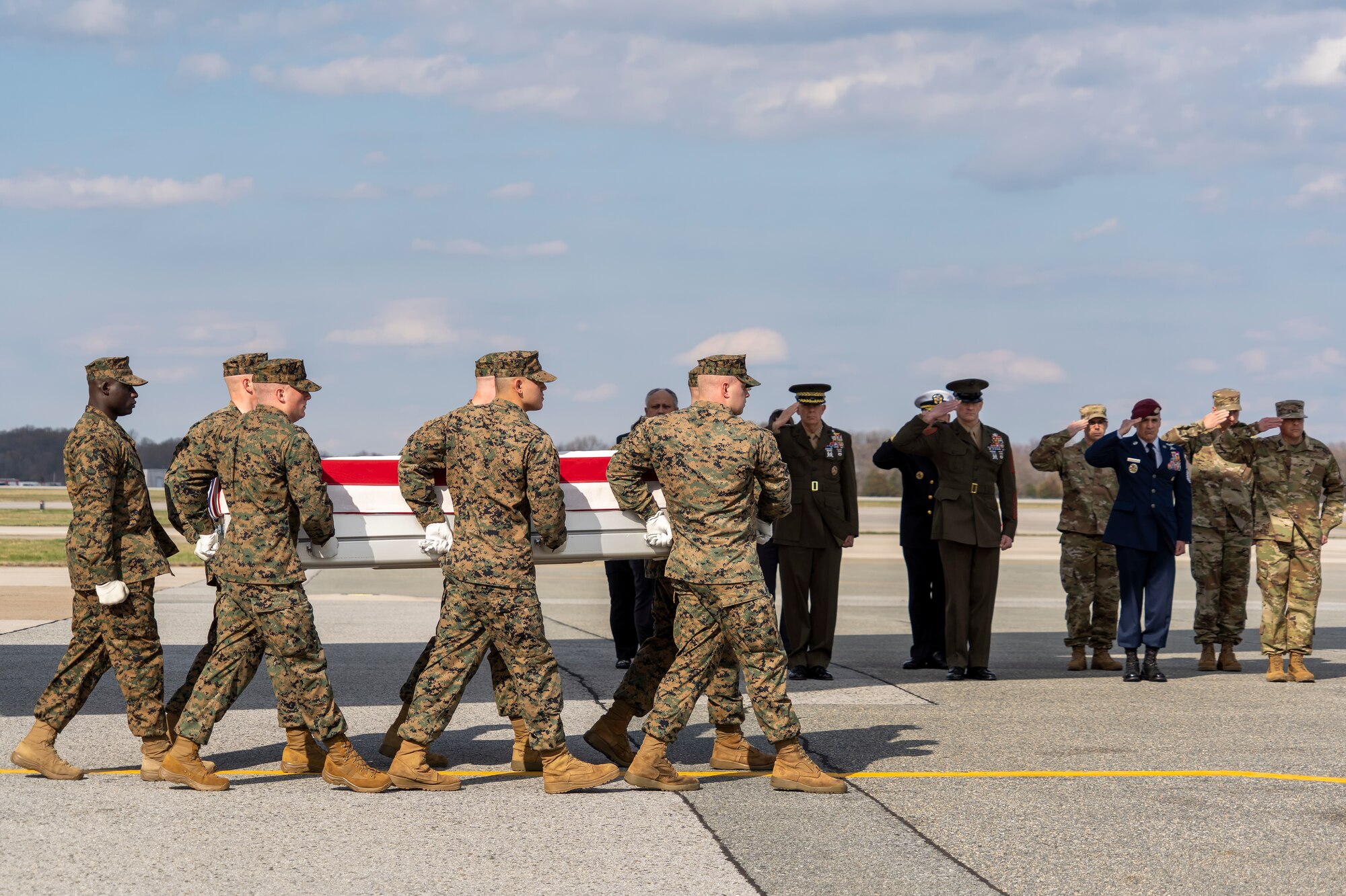 A U.S. Marine Corps carry team transfers the remains of Marine Corps Gunnery Sgt. James W. Speedy of Cambridge, Ohio, at Dover Air Force Base, Delaware, March 25, 2022. Speedy was assigned to Marine Medium Tiltrotor Squadron 261, Marine Aircraft Group 26, 2nd Marine Aircraft Wing, Marine Corps Air Station New River, North Carolina. (U.S. Air Force photo by Jason Minto)