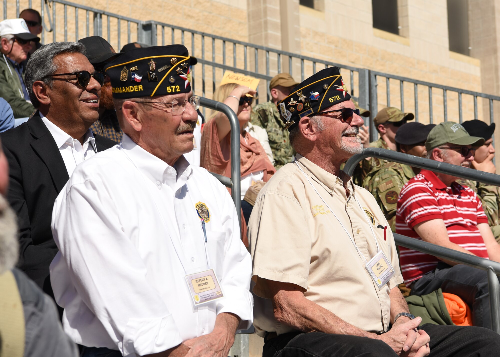 Military veterans watch the dedication event of the Weyandt-Eddy Memorial Plaza at Goodfellow Air Force Base, Texas, March 25, 2022. The event hosted over 200 service-connected families from across the nation.  (U.S. Air Force photo by Senior Airman Abbey Rieves)