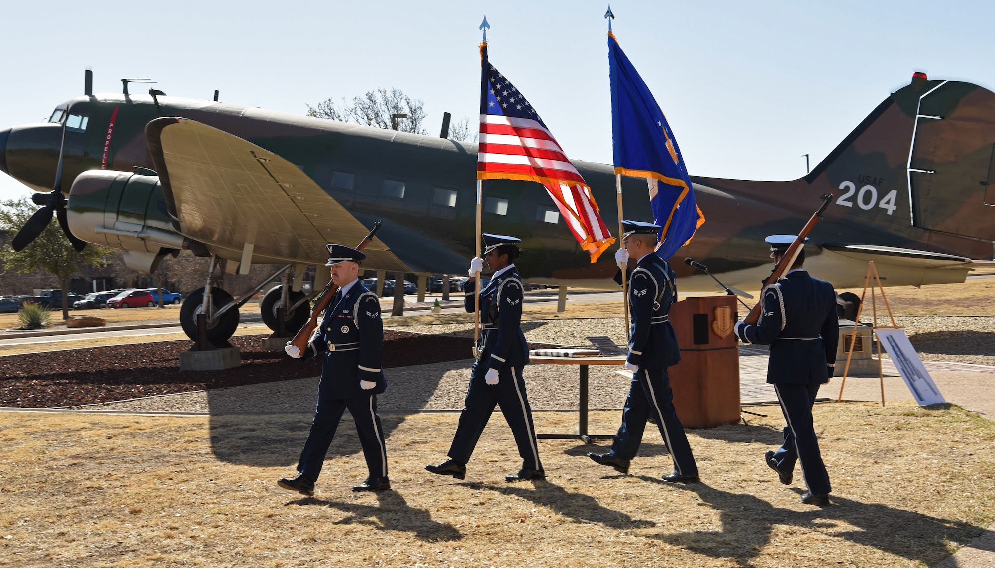 Service members assigned to the 17th Training Wing post the colors during the dedication of the Weyandt-Eddy Memorial Plaza at Goodfellow Air Force Base, Texas, March 25, 2022. The event  highlighted the United States Air Force Security Service and Tactical Air Command and their efforts to fulfill their cryptographic, communication intelligence mission. (U.S. Air Force photo by Senior Airman Abbey Rieves)