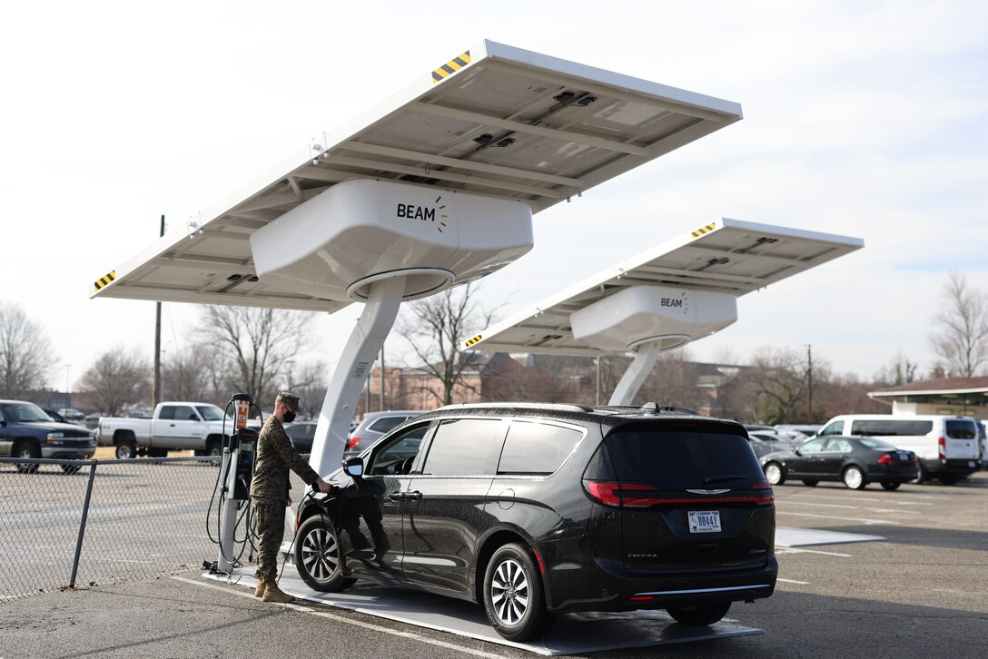 MARINE CORPS BASE QUANTICO, Va. (Feb. 8, 2022) A Marine driver for Marine Corps Base (MCB) Quantico, charges one of the government fleet vehicles with the Beam EV ARC 2020 electric vehicle chargers. MCB Quantico is one of 14 installations that will receive the chargers. MCICOM exercises command and control of Marine Corps installations via regional commanders in order to provide oversight, direction and coordination of installation services and to optimize support to the Operating Forces, tenants and activities. (U.S. Marine Corps photo by Erin Rohn)