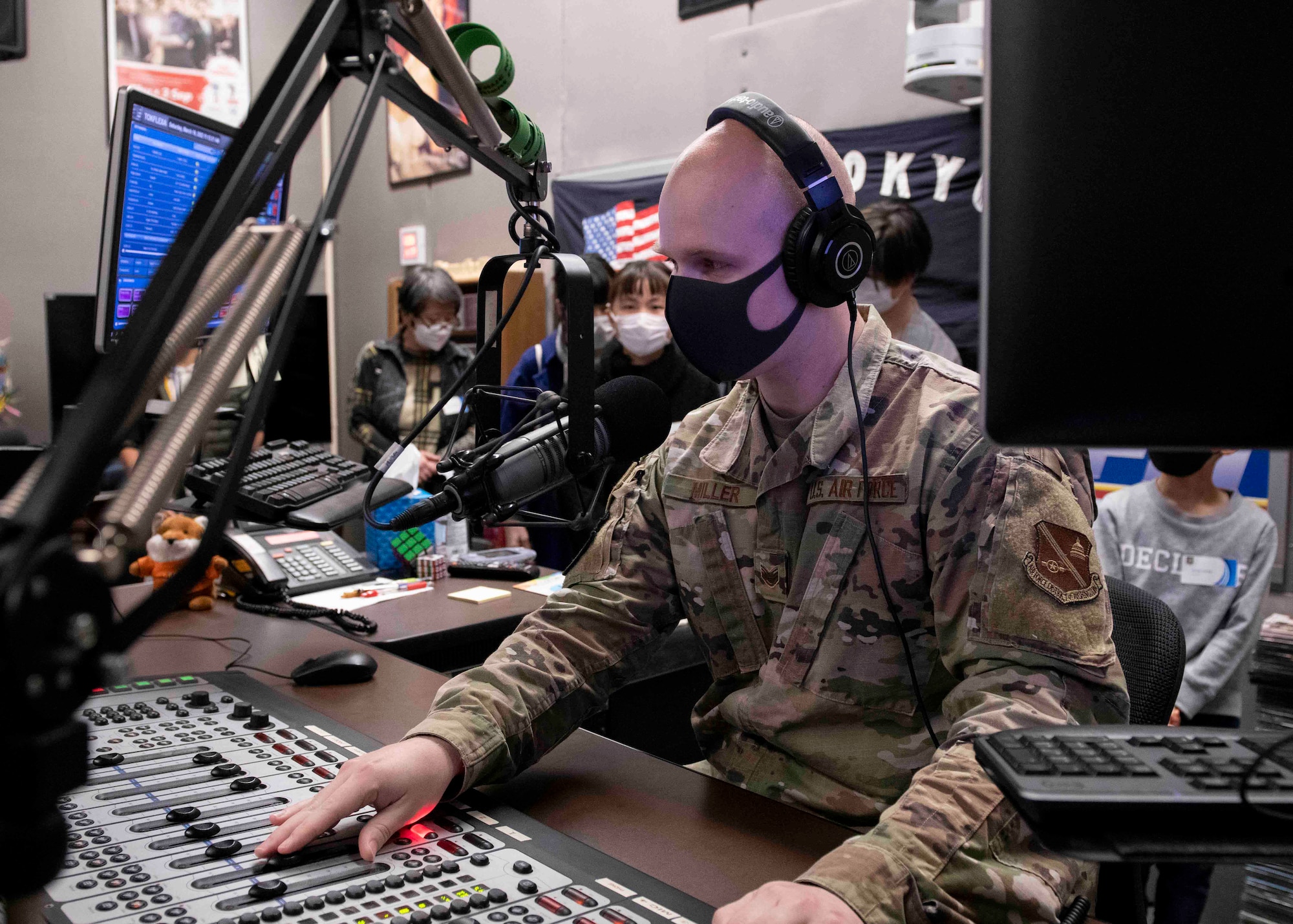 Staff Sgt. Brendan Miller, American Forces Network-Tokyo broadcast journalist, practices a radio broadcast during a community outreach event at Yokota Air Base, Japan, Mar. 19, 2022.