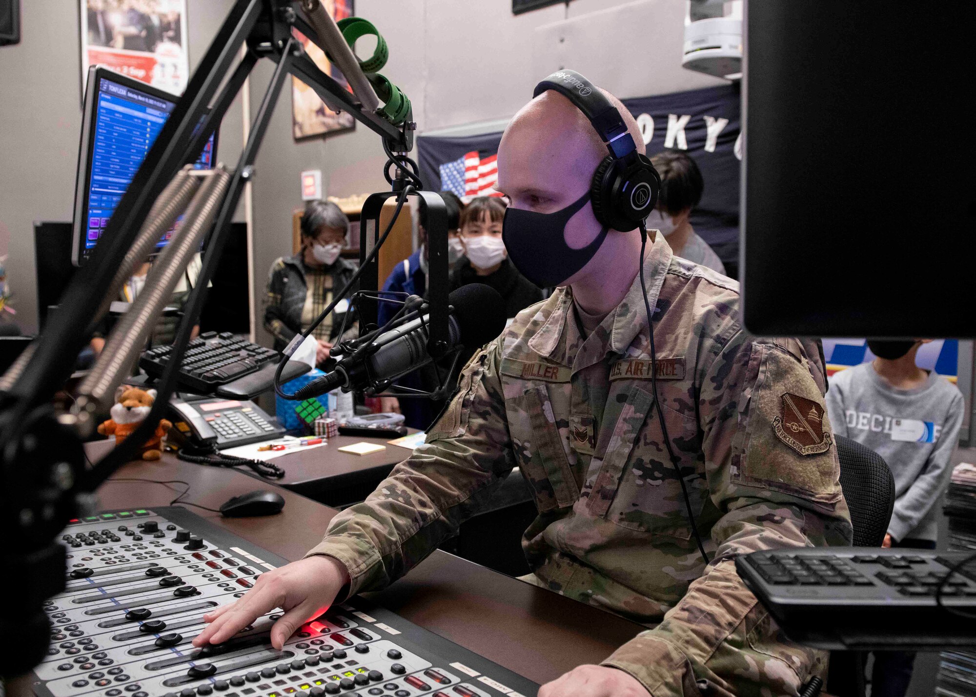 Staff Sgt. Brendan Miller, American Forces Network-Tokyo broadcast journalist, practices a radio broadcast during a community outreach event at Yokota Air Base, Japan, Mar. 19, 2022.