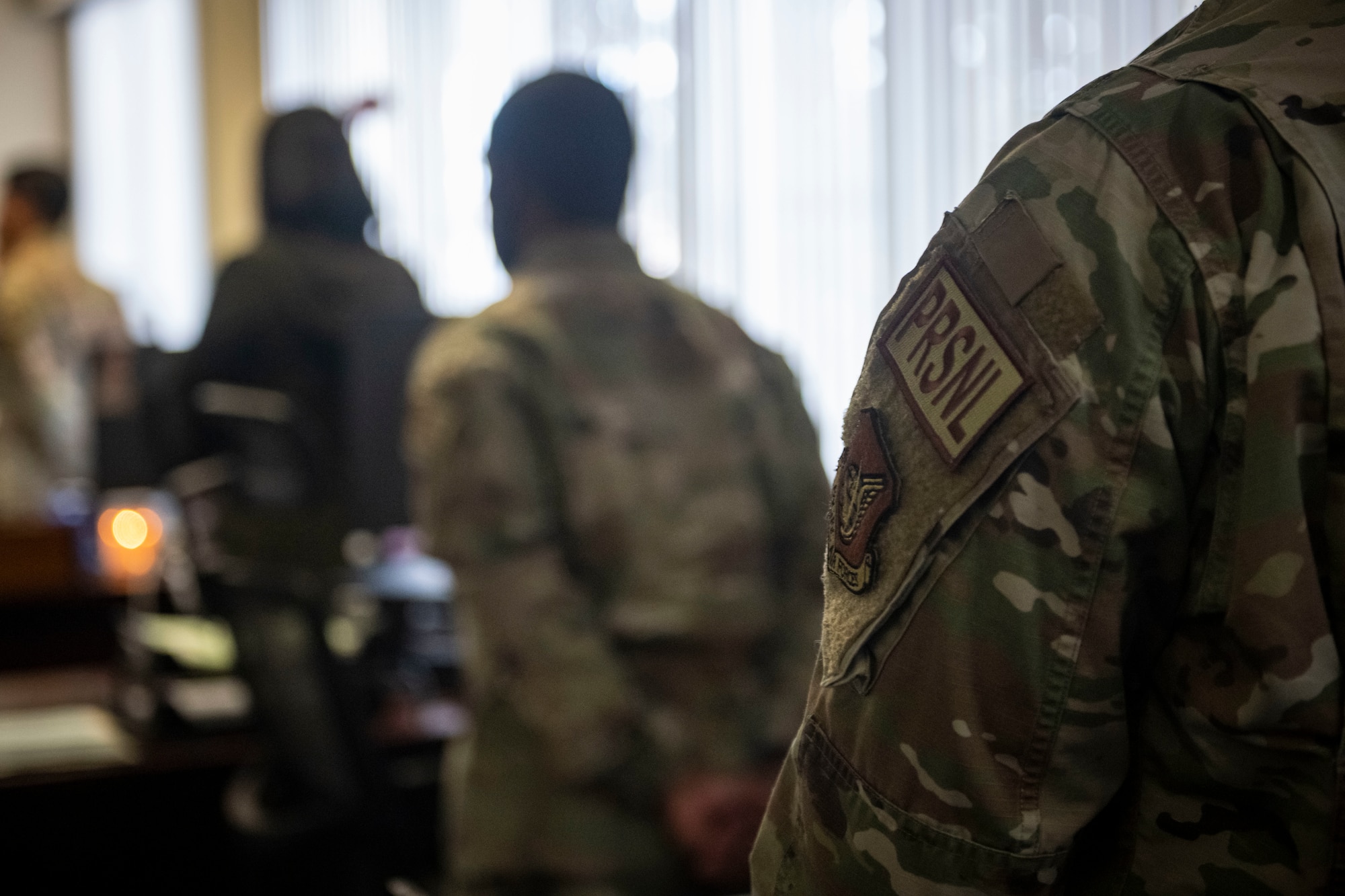 A military members patch on their uniform displays the 35th Personnel Flight.