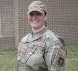 Airman posing for a photo outside