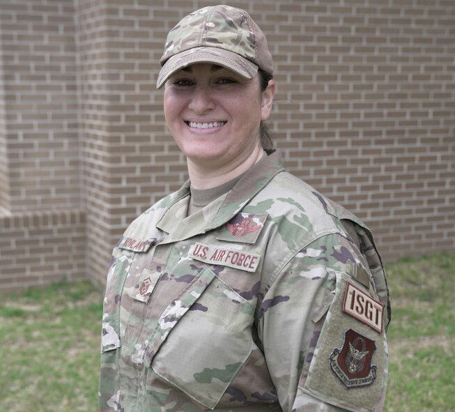 Airman posing for a photo outside