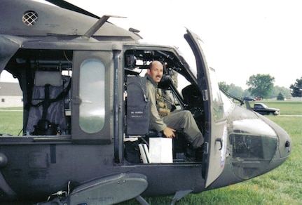 Chief Warrant Officer (5) David Hammon sits in the cockpit of a UH-60 Blackhawk at an aviation static display in southern Illinois in 1990. Hammon retires from the Illinois Army National Guard April 30 after a 42-year career. Hammon enlisted in the Illinois Army National Guard in 1980 as an aircraft mechanic.