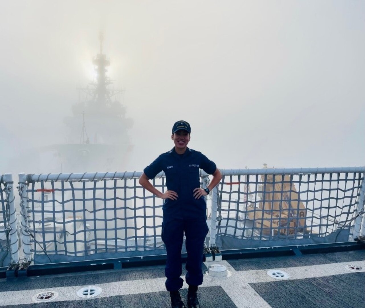 Lt. Jalle Merritt, a combat systems officer assigned to the Coast Guard Cutter Waesche, photographed with a national security cutter in the background. Merritt is slated to command the Coast Guard Cutter Myrtle Hazard in July 2022
