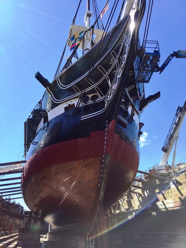 USS Constitution’s first 21st century dry docking is nearing completion and the ship will be undocked the night of July 23, 2017. In these final days in dry dock, the Naval History & Heritage Command Detachment Boston ship restorers and riggers are performing finishing touches around the ship.