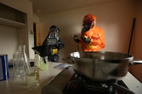 Alaska National Guardsmen Staff Sgt. Fabiana Kirtley (left) and Sgt. Andrew Hunt, 103rd Civil Support Team, conduct a site characterization sweep of a simulated chemical weapons lab during exercise Van Winkle 2022 in Juneau, Alaska, March 22. Van Winkle 2022 is a chemical, biological, radiological, nuclear and explosive response exercise designed to enhance interoperability between state, federal and local first responders with complex training scenarios. Exercise participants included CST units from the Alaska National Guard, Montana National Guard, Connecticut National Guard, Mississippi National Guard and North Carolina National Guard. (U.S. Army National Guard photo by Victoria Granado)