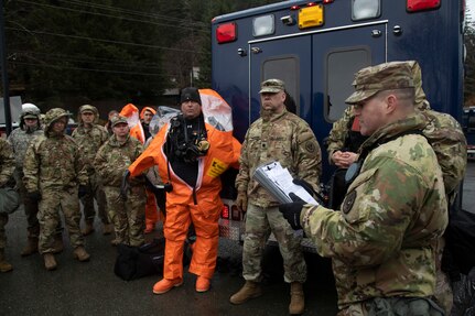Alaska Army National Guard Staff Sgt. Jonathan Ramos, section team leader for the 103rd Civil Support Team, gives an exercise brief prior to down-range operations during Van Winkle 2022 in Juneau, Alaska, March 22. Van Winkle 2022 is a chemical, biological, radiological, nuclear and explosive response exercise designed to enhance interoperability between state, federal and local first responders with complex training scenarios. Exercise participants included CST units from the Alaska National Guard, Montana National Guard, Connecticut National Guard, Mississippi National Guard and North Carolina National Guard. (U.S. Army National Guard photo by Victoria Granado)