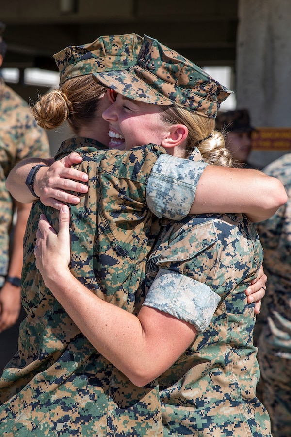 U.S. Marine 1st Lt. Riley Compton, the logistics officer with Marine Aviation Logistics Squadron 39, Marine Aircraft Group 39, 3rd Marine Aircraft Wing, is congratulated by a fellow Marine after receiving the Camp Pendleton Female Marine Athlete of the Year award during a ceremony on Camp Pendleton, California, March 18, 2022. Compton received this honor after being nominated by her command for her various physical achievements in 2021, including becoming a developmental bobsled pilot for Team USA. Compton is a native of Carmel, Indiana. (U.S. Marine Corps photo by Cpl. Alison Dostie)